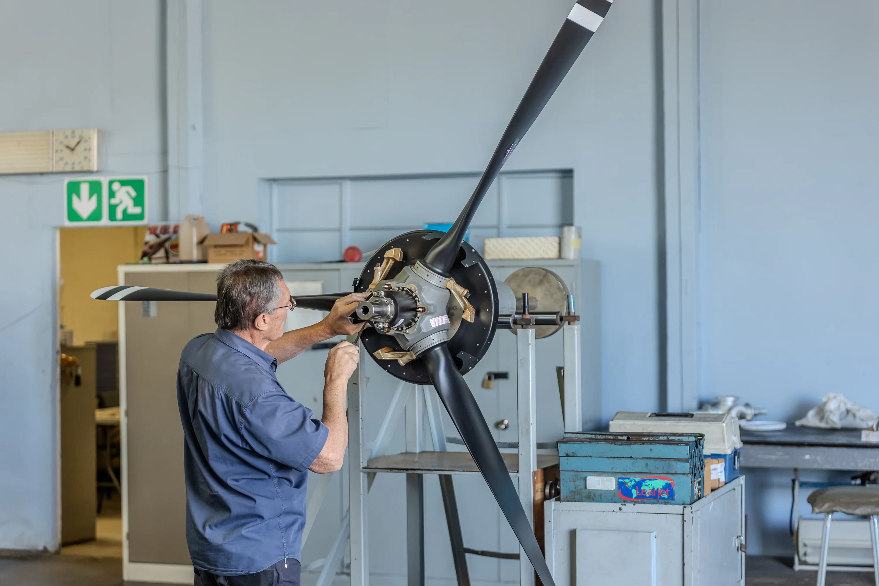 Technician inspecting an aircraft propeller hub