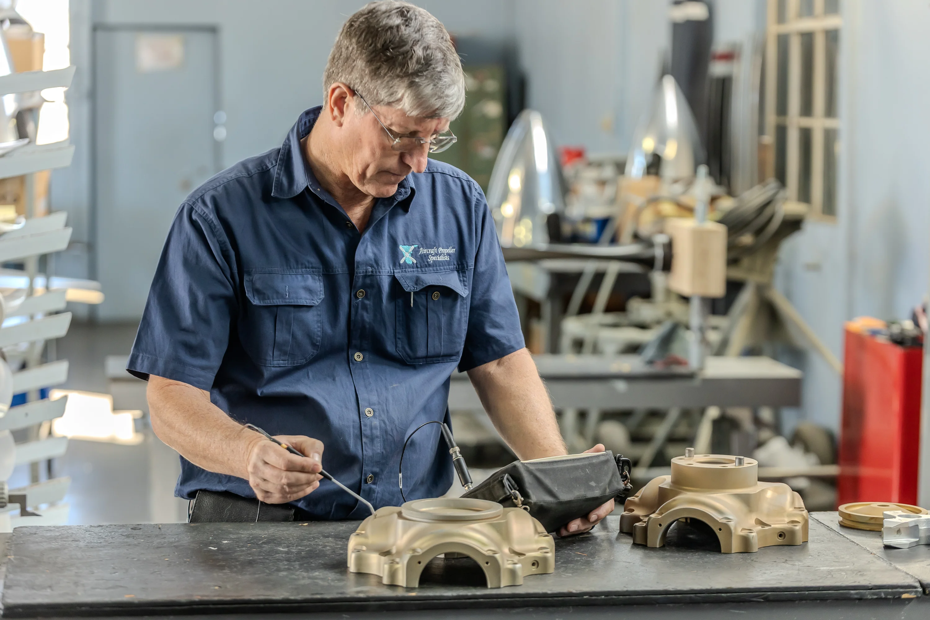 Technician completing precision component work