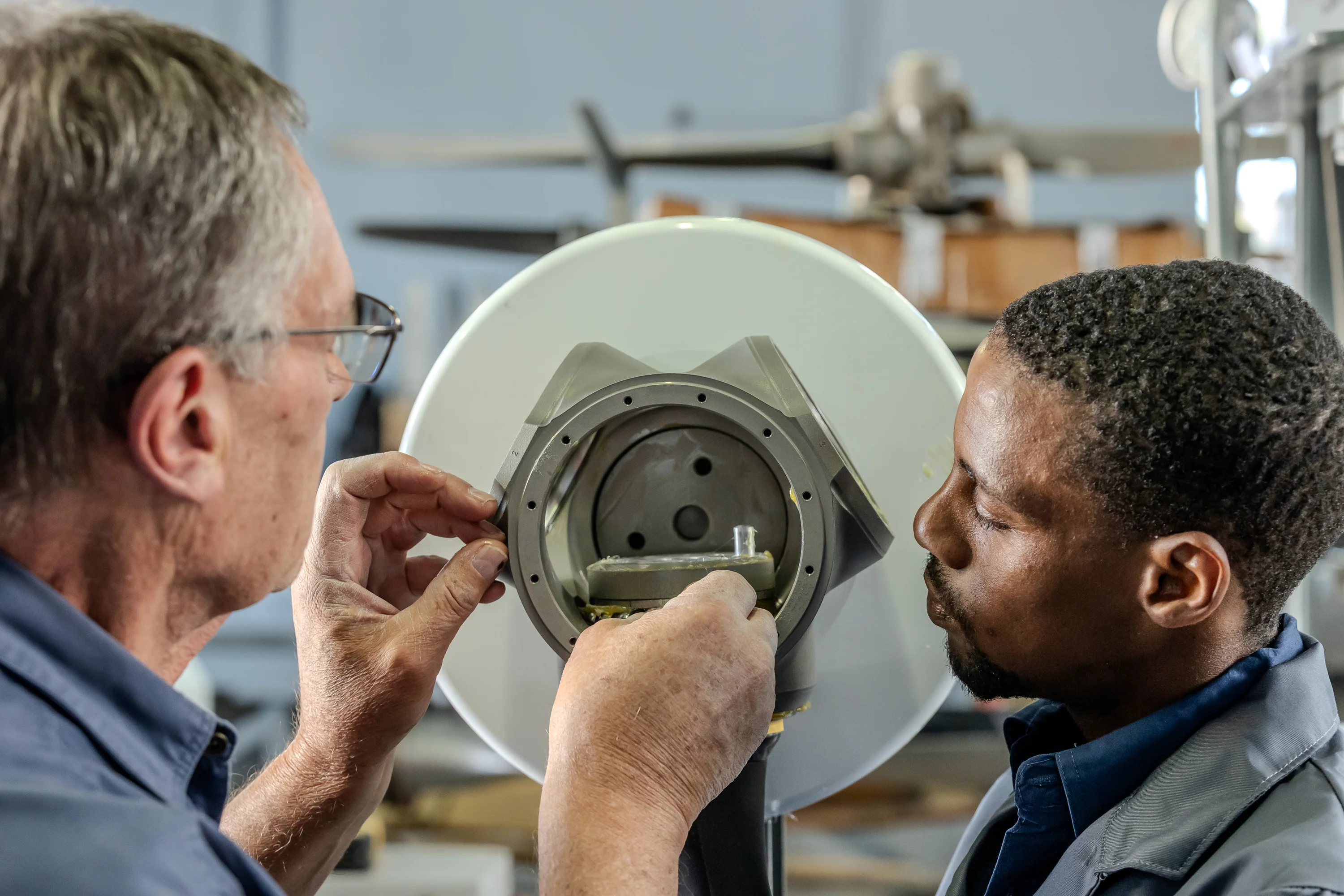 Specialists completing detailed hub assembly work